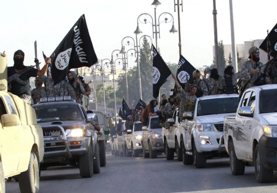 Daesh holding a parade in Raqqa in June, 2014. (photo credit: REUTERS)