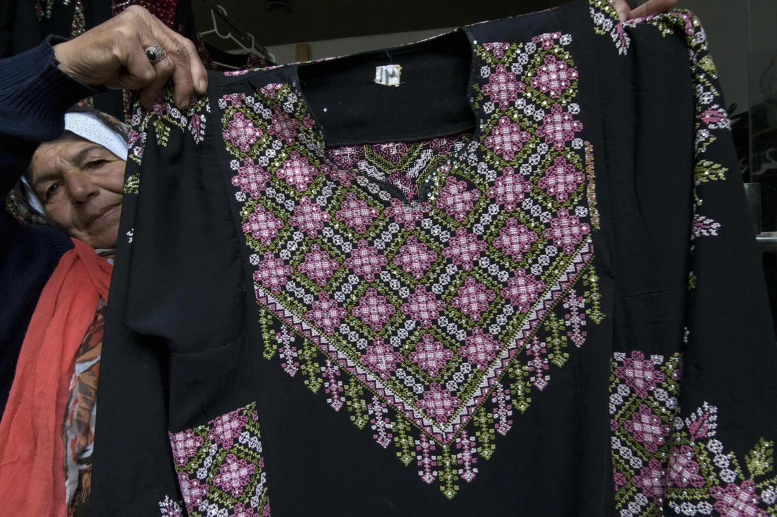 The thobe is gaining prominence as a softer symbol of Palestinian nationalism, competing with the classic keffiyeh. (AP)
