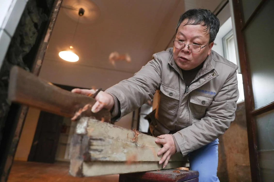Ma Jiale uses the old tools he received from his predecessors to preserve the features of the historic structures. (AFP)