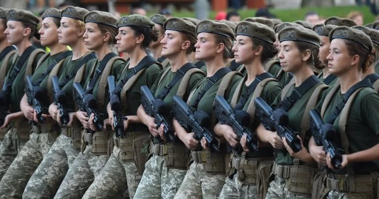 There are 57,000 women in the Ukrainian armed forces, 26,000 of which are on active duty. Above, Ukrainian women soldiers train for a military parade for 2018 Independence Day. (AFP)