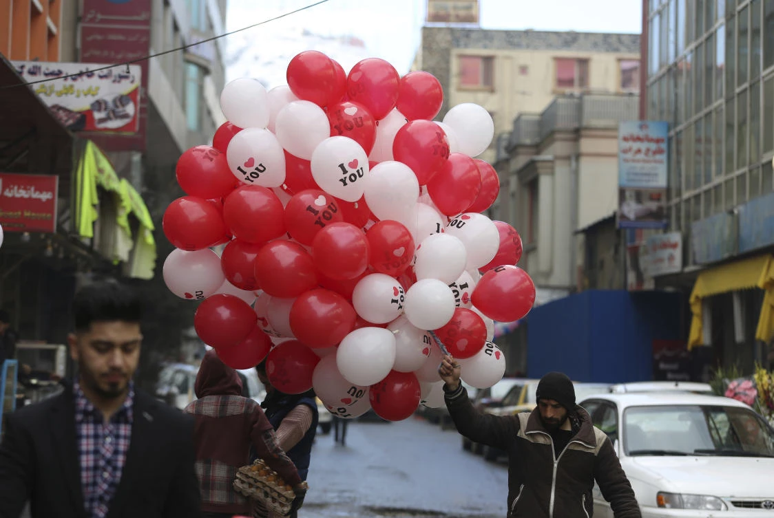 Flower shops in the Afghan capital Kabul's famous "chicken street market" were festooned with bright red and white heart-shaped balloons to mark Valentine's Day, a sharp contrast from Taliban rule when the holiday was banned. (File/AP)