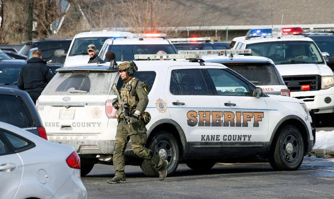 Law enforcement personnel gather near the scene where an active shooter was reported in Aurora, Ill., Friday, Feb. 15, 2019. ((AP)