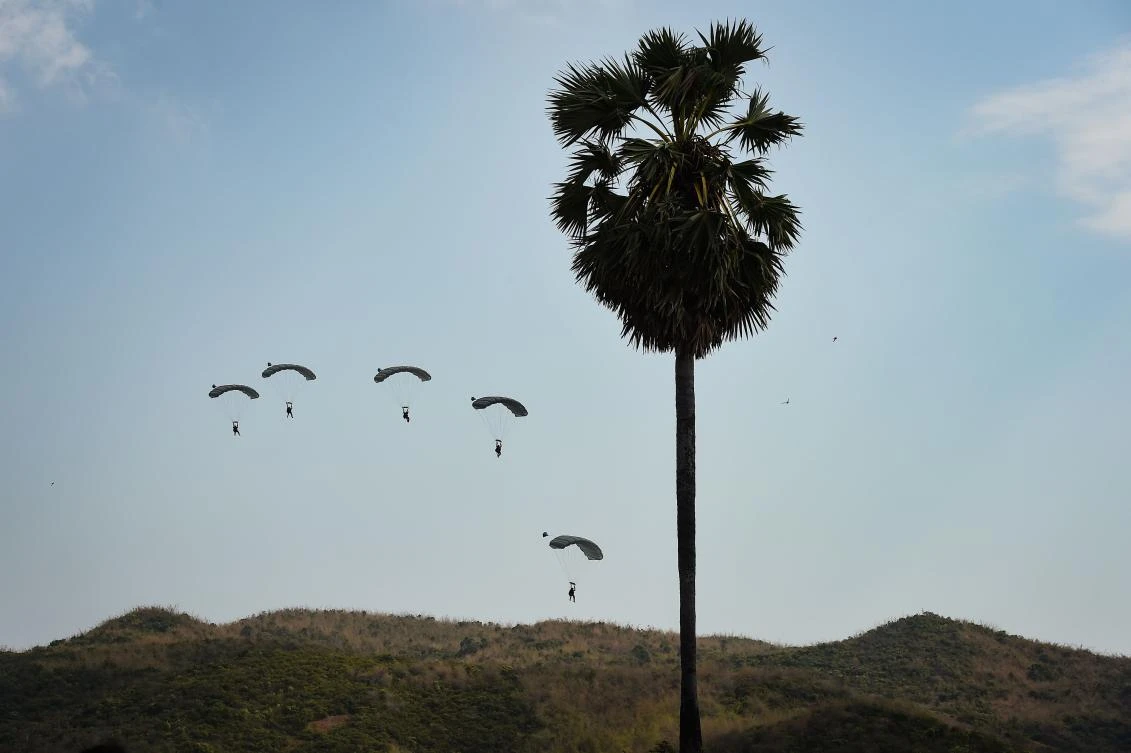 US Navy paragliders take part in an amphibious landing in Chonburi. (AFP)