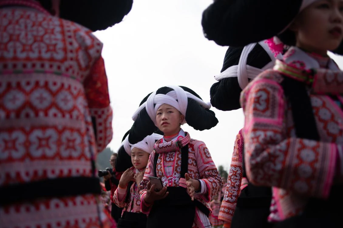 Girls sport their ancestors’ hair for Lunar New year in China