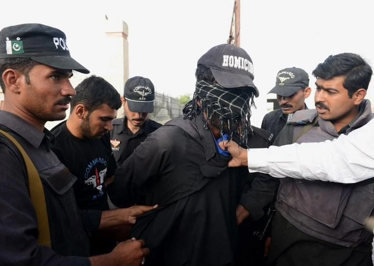 Pakistani soldiers arrest a suspect during an operation in Baluchistan province, which has been a hotbed for militants, in this June 2013 photo. (AFP)
