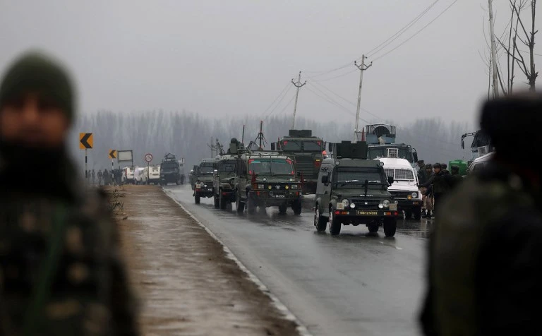 Security forces drive to the site where an Indian paramilitary convoy was hit by a suicide bombing that killed 44 troopers, which was claimed allegedly by Pakistan-supported militants. (AFP)