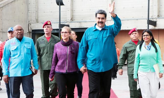 Venezuela's President Nicolas Maduro and his wife Cilia Flores, attend a meeting with supporters in Caracas, Venezuela January 22, 2019. (REUTERS)