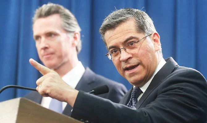 California Attorney General Xavier Becerra, right, accompanied by Gov. Gavin Newsom, said California will probably sue President Donald Trump over his emergency declaration to fund a wall on the U.S.-Mexico border Friday, Feb. 15, 2019, in Sacramento, Calif. (AP)