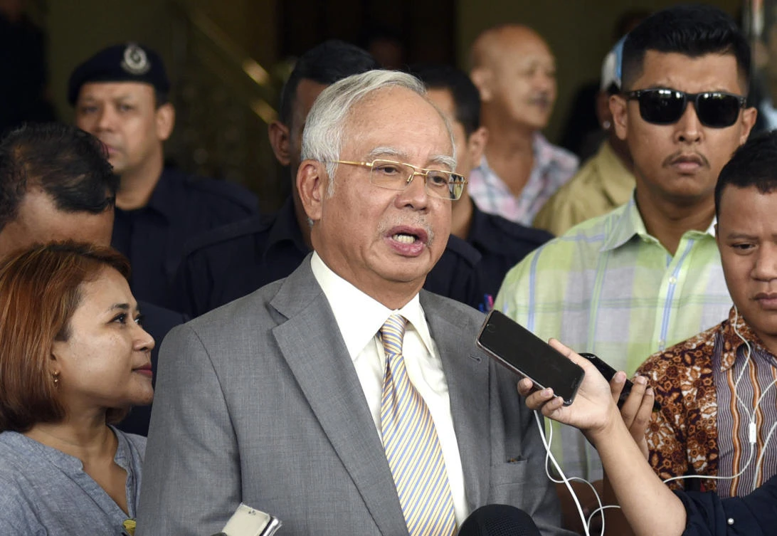 Former Malaysian Prime Minister Najib Razak is hardly lying low ahead of his corruption trial on charges related to the multibillion-dollar looting of the 1MDB state investment fund. (File/AP)