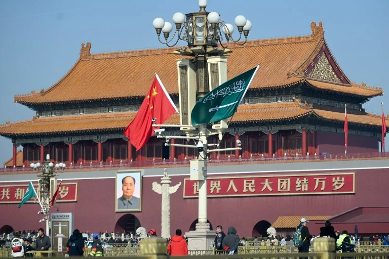 The countries will sign agreements and memorandums in the final meeting. Above, the national flags of Saudi and China are displayed in Beijing on Feb. 21, 2019. (AFP)