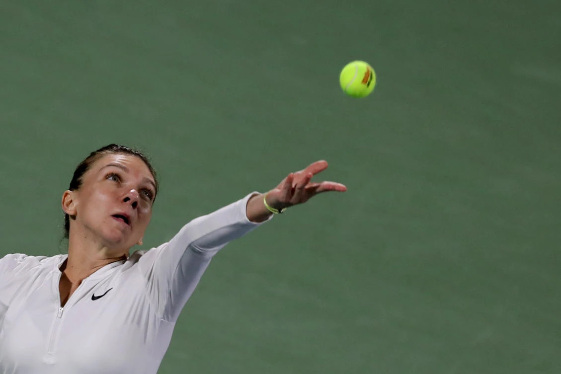 Despite the defeat the Romanian star is still sure she'll win titles and trophies this year. (AFP)