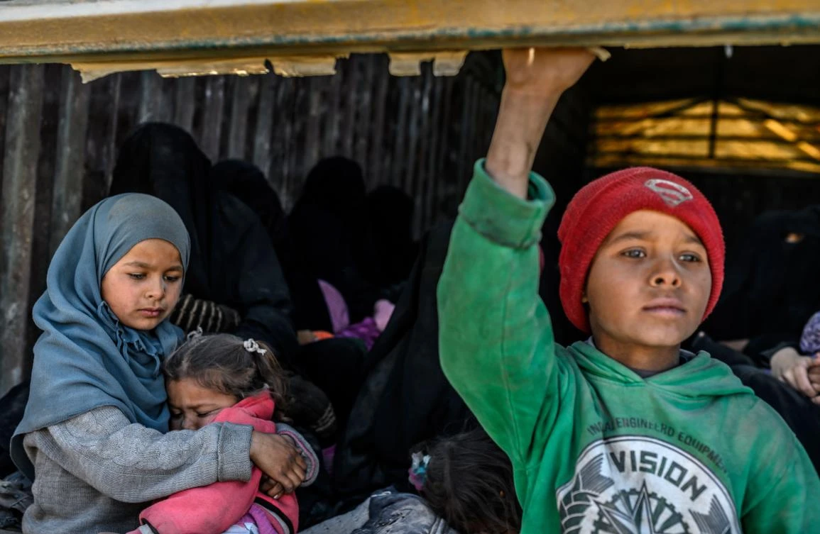 A picture taken on February 20, 2019 shows a truck carrying men, identified as Daesh group fighters who surrendered to Kurdish-led Syrian Democratic Forces (SDF). (AFP)