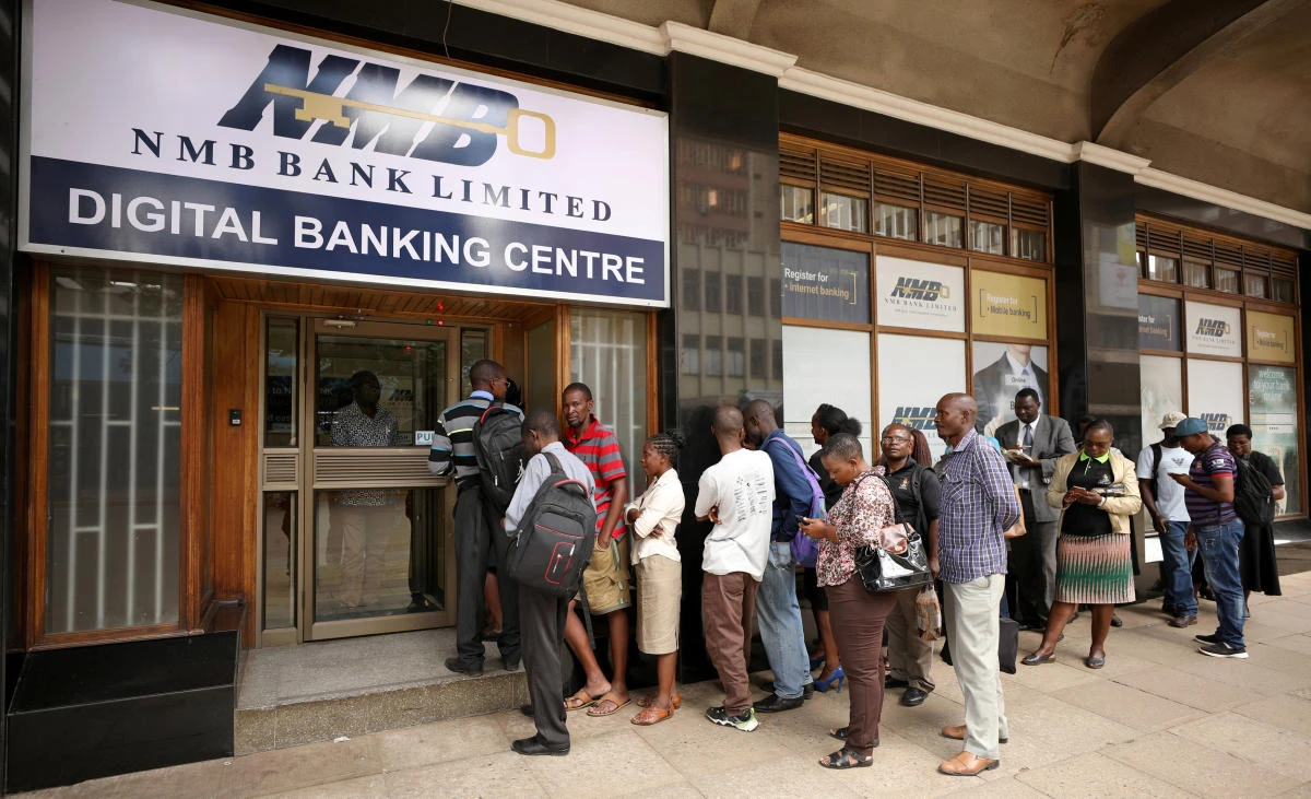 Commercial banks reopened on Friday in Zimbabwe after a bank holiday, with queues outside no longer than usual. (Reuters)