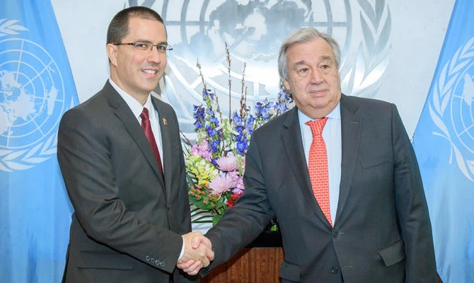 In this photo provided by the United Nations, Jorge Arreaza, left, Minister of the People's Power for Foreign Affairs, Bolivarian Republic of Venezuela, shakes hands with Nations Secretary General Antonio Guterres at United Nations headquarters on Friday, Feb. 22, 2019. (AP)