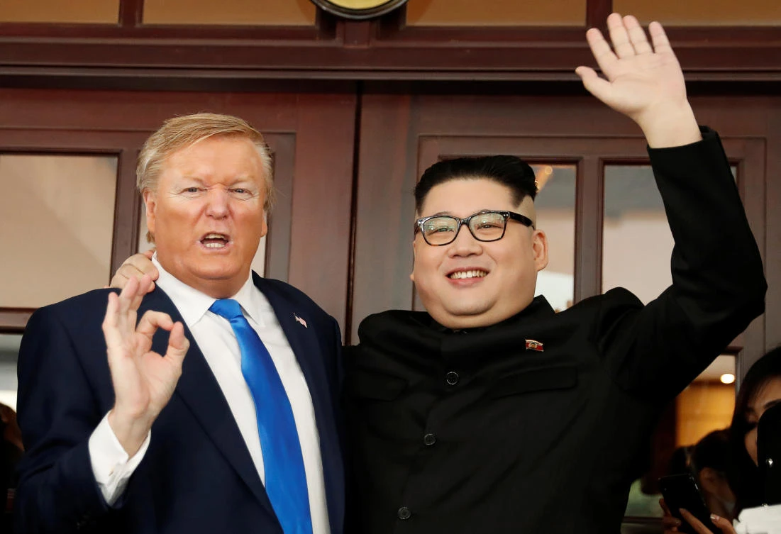 Howard X, an Australian-Chinese impersonator of North Korean leader Kim Jong Un and Dennis Alan, who is impersonating US President Donald Trump, pose for a photo at Metropole Hotel in Hanoi, Vietnam on Friday, February 22. (Reuters)