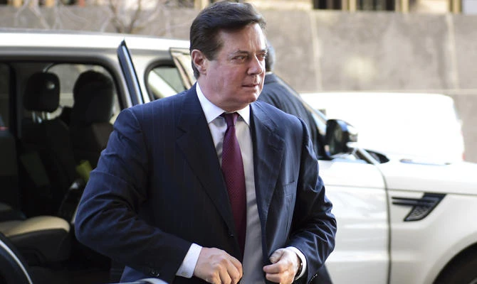 In this Dec. 11, 2017, file photo, former Trump campaign chairman Paul Manafort arrives at federal court in Washington. (AP Photo/Susan Walsh, File)