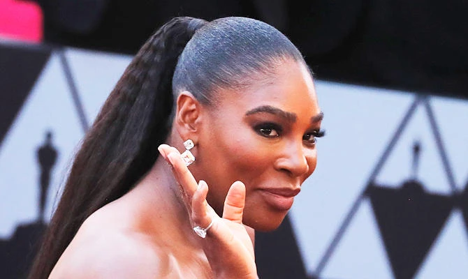 Tennis player Serena Williams of the U.S. waves. (REUTERS)