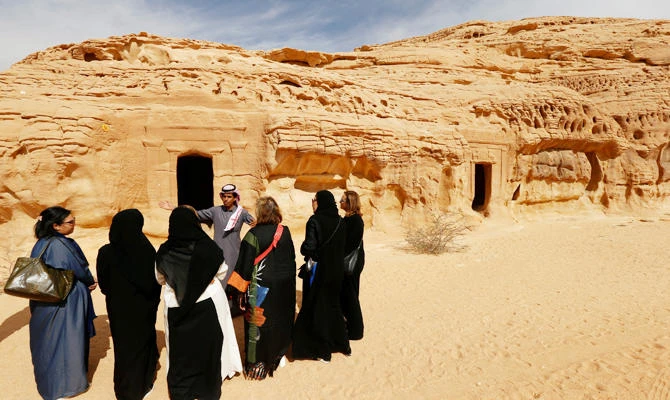 Visitors tour at majestic rock-hewn tombs of Madain Saleh near the city al-Ula, Saudi Arabia January 25, 2019. (REUTERS)