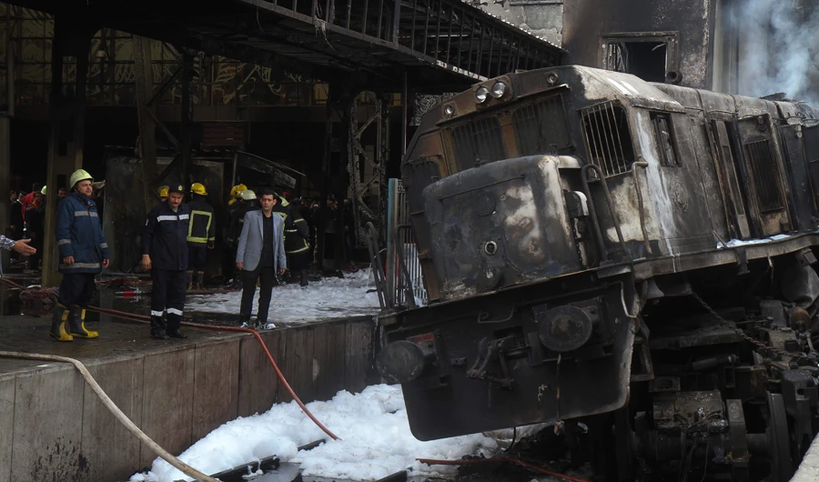 Firefighters at the scene of the train crash at Cairo’s main railway station on Wednesday, above. (AFP)