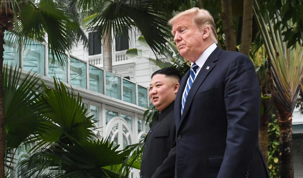 US President Donald Trump (R) walks with North Korea's leader Kim Jong Un during a break in talks at the second US-North Korea summit at the Sofitel Legend Metropole hotel in Hanoi on February 28, 2019. (AFP)