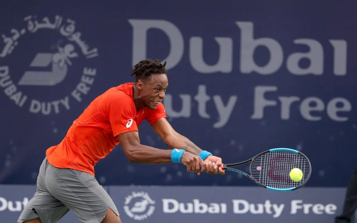 Gael Monfils of France returns the ball to Lithuania's Ricardas Berankis during the ATP Dubai Tennis Championship in Dubai. (AFP)