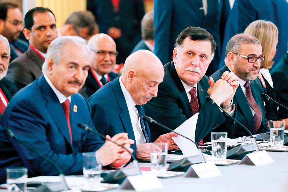 Libyan Prime Minister Fayez Al-Serraj, 3rd left, and the rival leader, military commander Khalifa Haftar, left, have met in Abu Dhabi on Wednesday. (AFP)