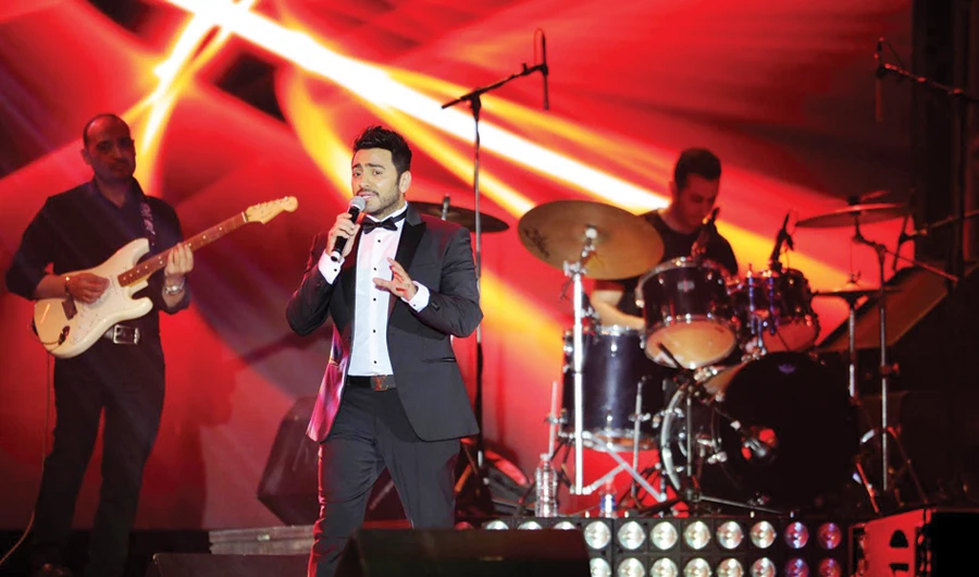Egyptian pop sensation Tamer Hosny performs in Jeddah. Saudi Arabia is aiming to organize and develop the entertainment sector and support its infrastructure through cooperation with various governmental sectors and private entities. (AFP/File photo)
