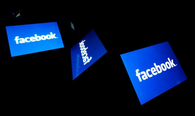 This illustration file picture shows the US social media Facebook logo displayed on a tablet in Paris on February 17, 2019. (AFP)
