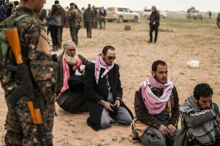 The semi-autonomous Kurdish administration said in a statement those released ‘have no Syrian blood on their hands.’ Above, members of the Syrian Democratic Forces question suspected Daesh militants. (AFP)