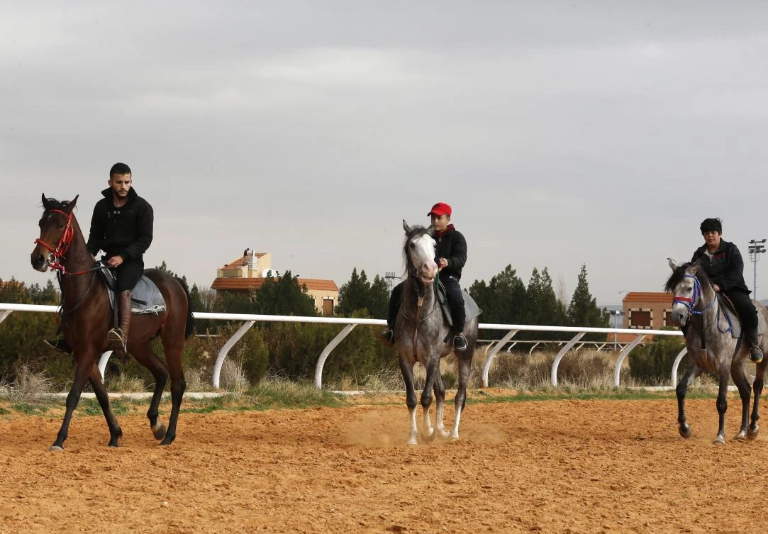 Syrian equestrians ride their horses at a track in the town of Dimas, west of the capital Damascus on December 5, 2018. (AFP)