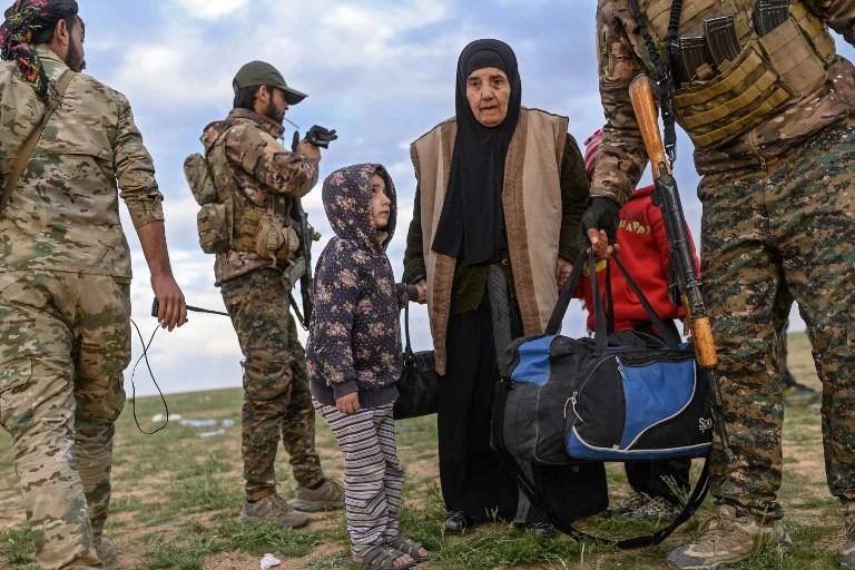 Thousands of civilians left the village as US-backed SDF forces carried out attacks. (AFP)