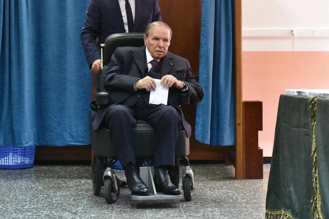 In this file photo taken on May 04, 2017 Algerian President Abdelaziz Bouteflika is seen on a wheelchair as he votes at a polling station in Algiers. (AFP/Ryad Kramdi)