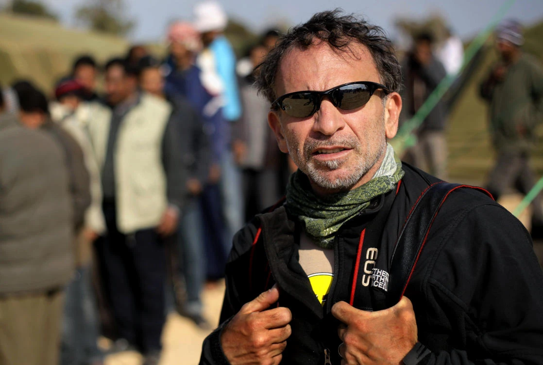 Greek photojournalist Yannis Behrakis at a refugee camp in Ras Ajdir, Tunisia. Yannis Behrakis, a Pulitzer Prize-winning photojournalist, has died. He was 58. (Lefteris Pitarakis / AP Photo)