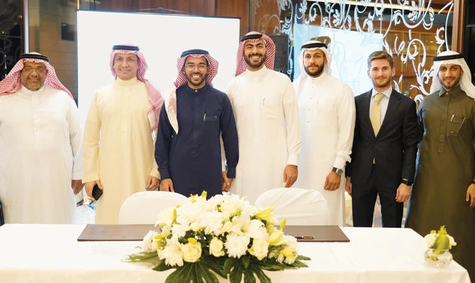 Salman Gasim, third left, with Hammam Zare, center, after signing the agreement to launch the STTAR accelerator program during a launch ceremony at the Sofitel hotel in Jeddah on Sunday. (Supplied)