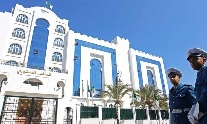 Police officers stand outside of the Constitutional Council building in Algiers, Algeria, Sunday, march 3, 2019. (AP)