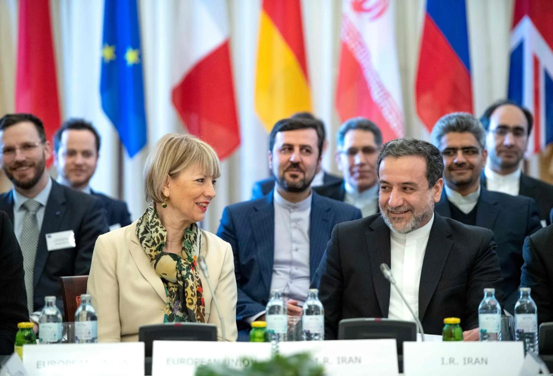 Abbas Araghchi (R), political deputy at the Ministry of Foreign Affairs of Iran, and the Secretary General of the European Union's External Action Service (EEAS) Helga Schmid talk as they take part in a meeting of the Joint Commission of the Joint Comprehensive Plan of Action (JCPOA) attended by the E3+2 (China, France, Germany, Russia, United Kingdom) and Iran at Palais Coburg in Vienna, Austria on March 6, 2019. (AFP)