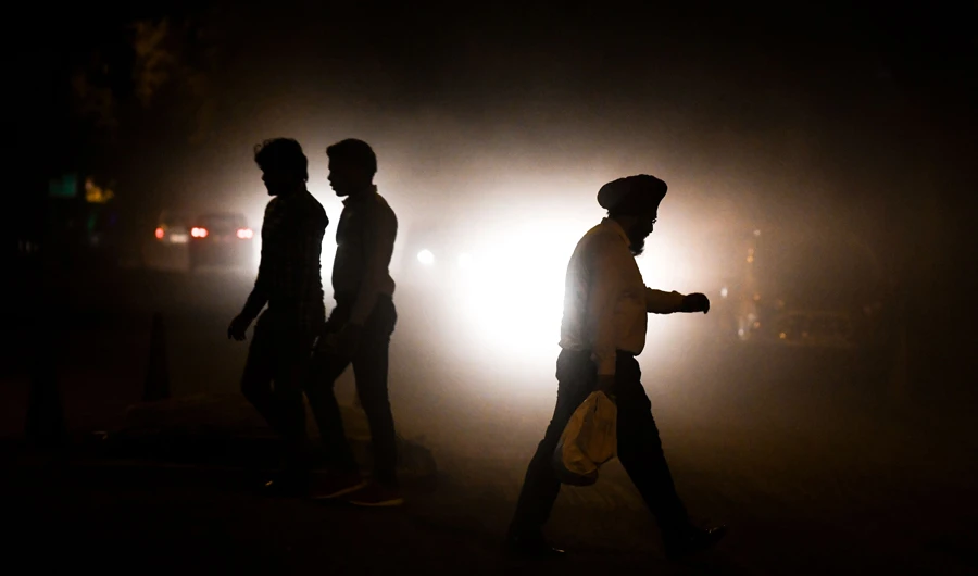 In this file photo taken on September 26, 2018 Indian commuters walk amid air pollution in New Delhi. India dominated a list of the world's most polluted cities in 2018, taking 22 of the top 30 spots, according to a Greenpeace report. (AFP)