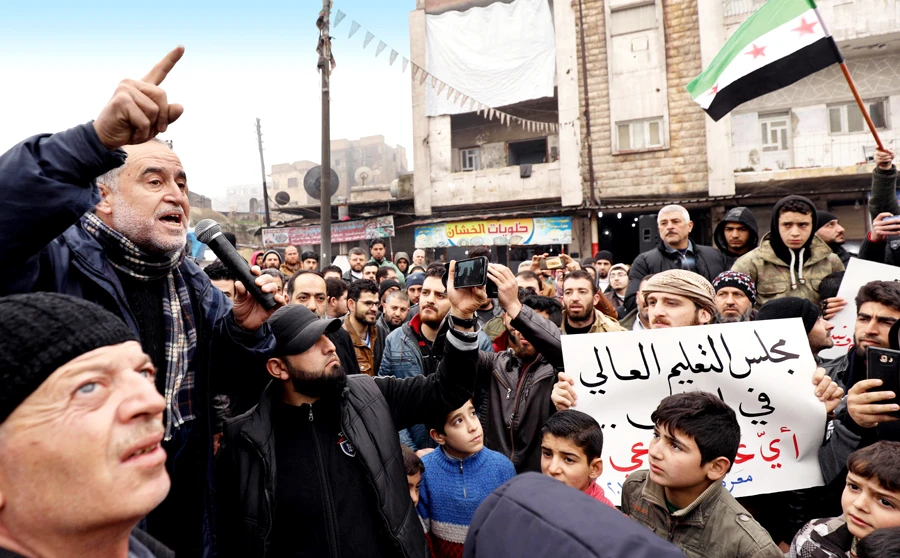 Syrian university students protest in the city of Maaret Al-Numan in Idlib. (AFP)