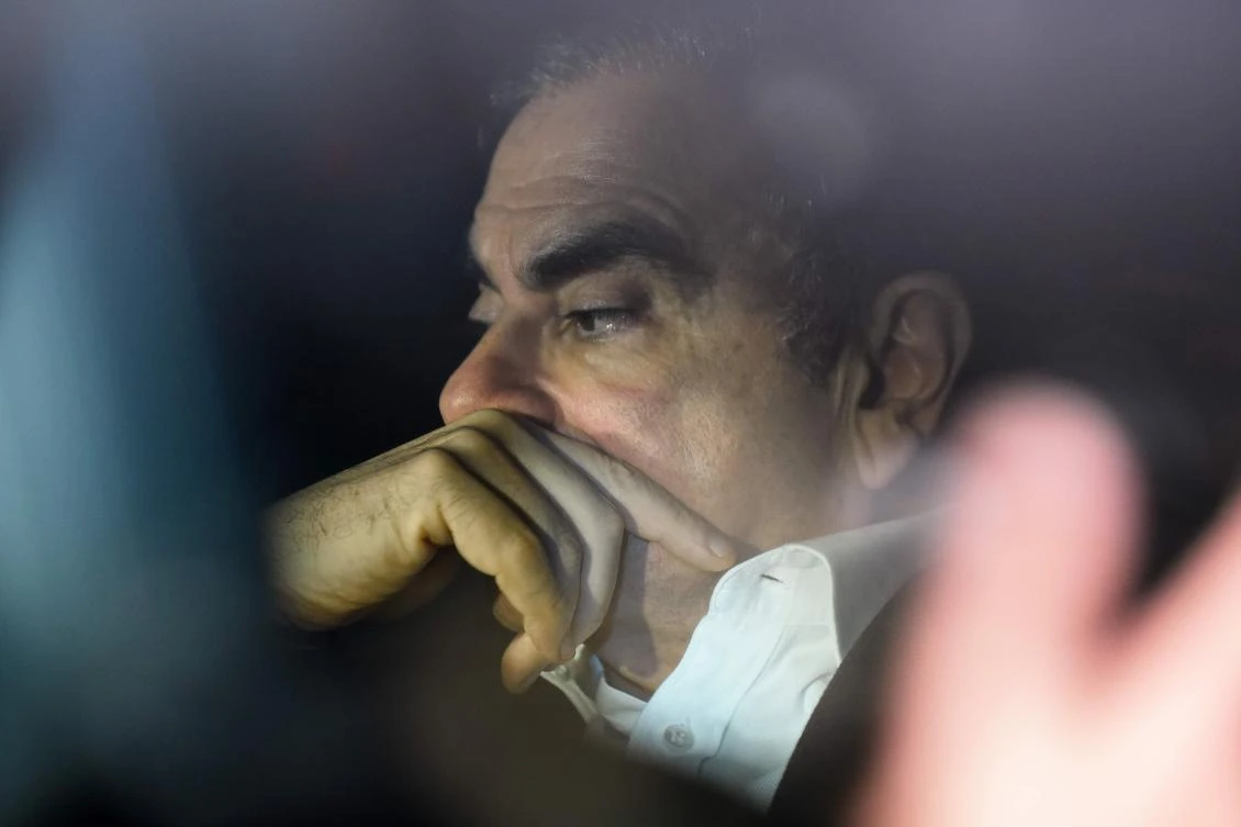 Former Nissan chairman Carlos Ghosn leaves his lawyers’ offices after he was released earlier in the day from a detention center after posting bail in Tokyo on March 6, 2019. (AFP)