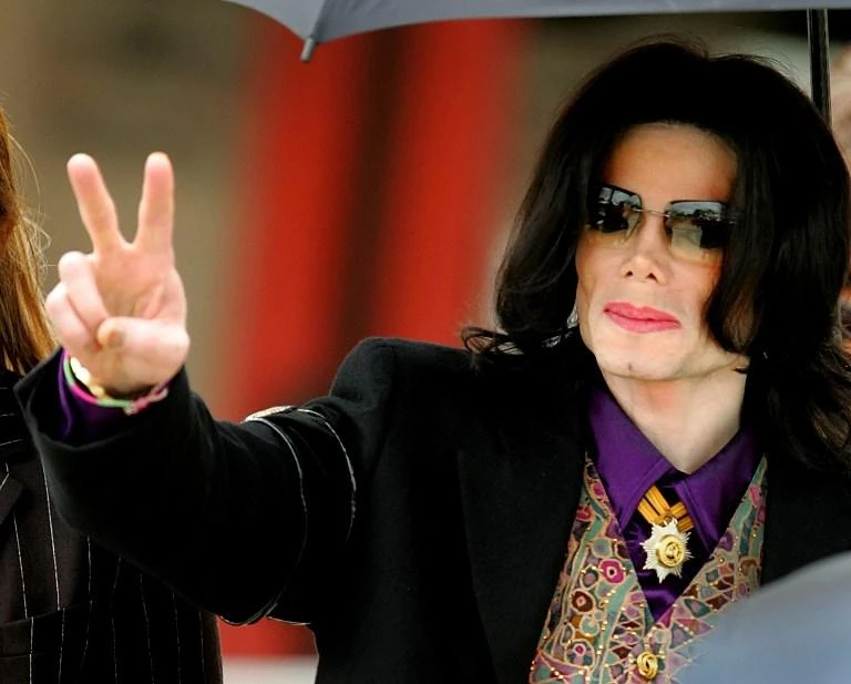 Michael Jackson walks out of the Santa Barbara County Courthouse on the fourth day of his child molestation trial in this March 3, 2005 photo. (Getty Images North America/AFP)