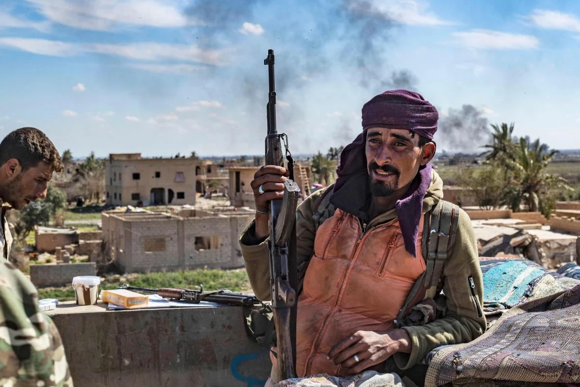 Members of Daesh have been surrendering in their droves after being bombarded in Baghouz by members of the Syrian Democratic Forces (SDF). (AFP/Delil Souleiman)