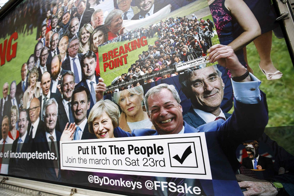 A van with a billboard entitled Breaking Point and aimed at holding the 'Brext Elite' to account, is pictured during its unveiling by For our Future's Sake (FFS) — the youth and student wing of the People's Vote campaign — near the Houses of Parliament in London on March 7, 2019. (AFP / Tolga Akmen / Tolga Akmen)