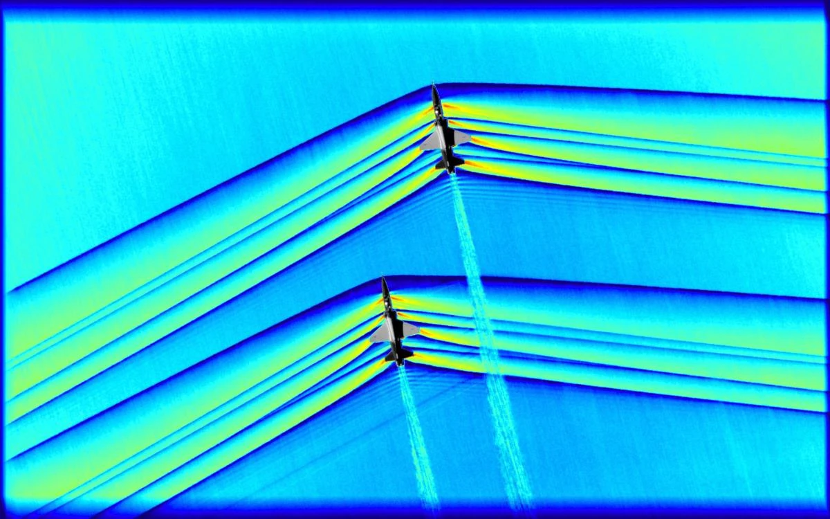 This handout colorized composite image released by NASA on February 7, 2019 shows two T-38 aircrafts flying in formation at supersonic speeds producing shockwaves that are typically heard on the ground as a sonic boom. (AFP/NASA/HO)
