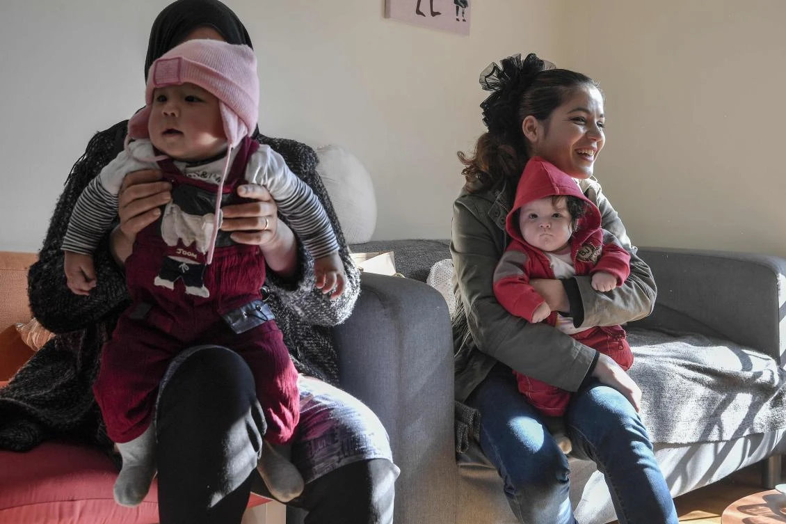 Mothers and their children in a center run by the Amurtel NGO in Athens’ Victoria Square. (AFP)
