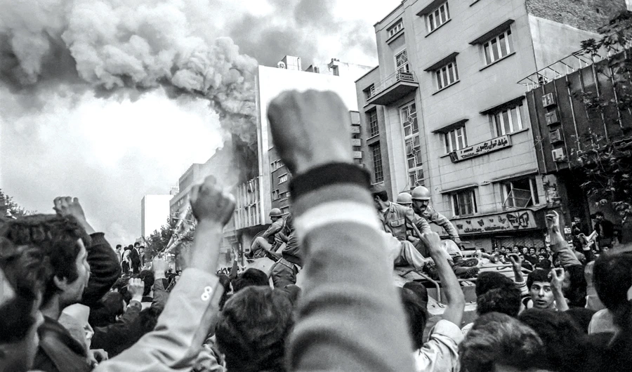 Troops loyal to the shah try to control a crowd of demonstrators in Tehran in November 1978. (AFP)