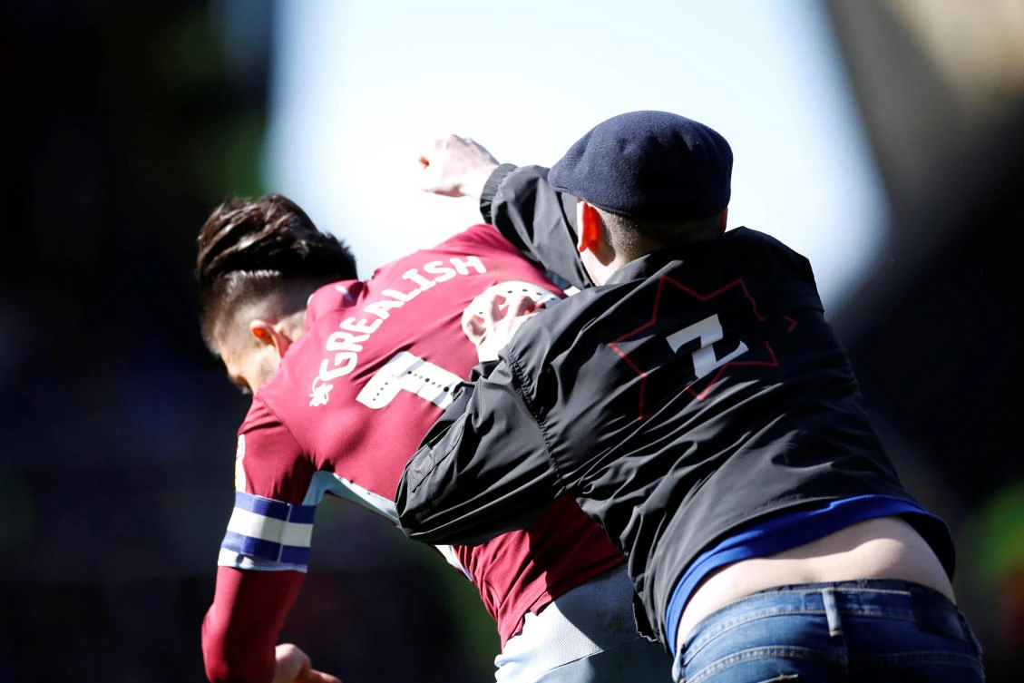 Fan punches Aston Villa's Jack Grealish in the face during derby