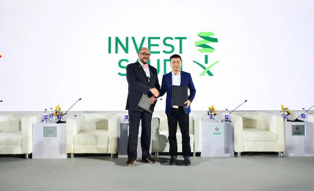 Jollychic and SAGIA exchanging the agreement to form a comprehensive partnership in the field of digital economy. (Supplied)
