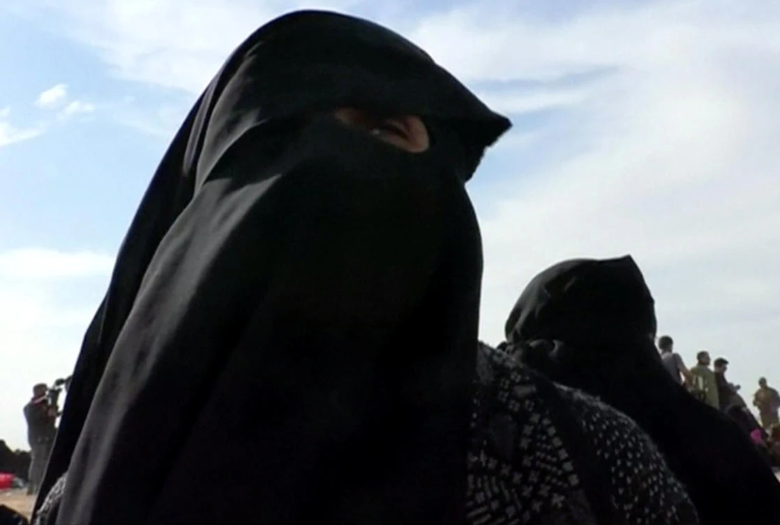 Um Walaa, originally from Morocco with French nationality, and widow of an Daesh fighter, is seen near Baghouz, Syria in this still image taken from a video shot on March 5, 2019. (Reuters)