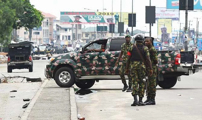 Soldiers block with a truck the road leading to the state headquarters of Independent National Electoral Commission (INEC) in Port Harcourt, Rivers State, on March 10, 2019. (AFP)