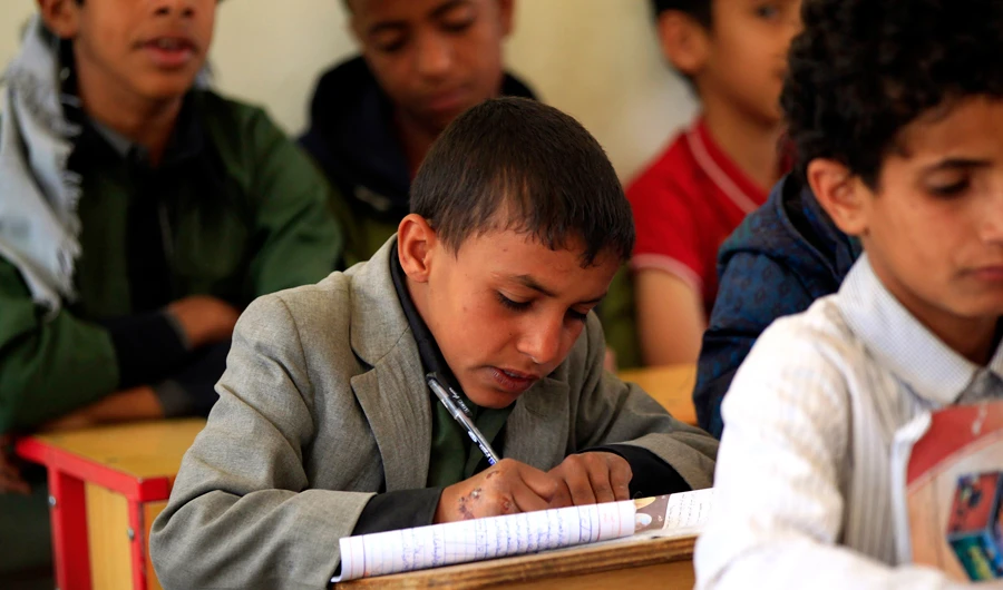 Yemeni children attend a class at an orphanage in Sanaa on March 10, 2019. The UN estimates that out of seven million school-age children in Yemen over two million are not being educated as infrastructure has been destroyed or repurposed to house those displaced by the four-year conflict. (AFP / MOHAMMED HUWAIS)
